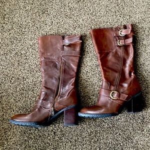 Born heeled boots.  Inside zipper.